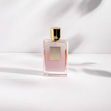 Perfume bottle with pink label on a white background