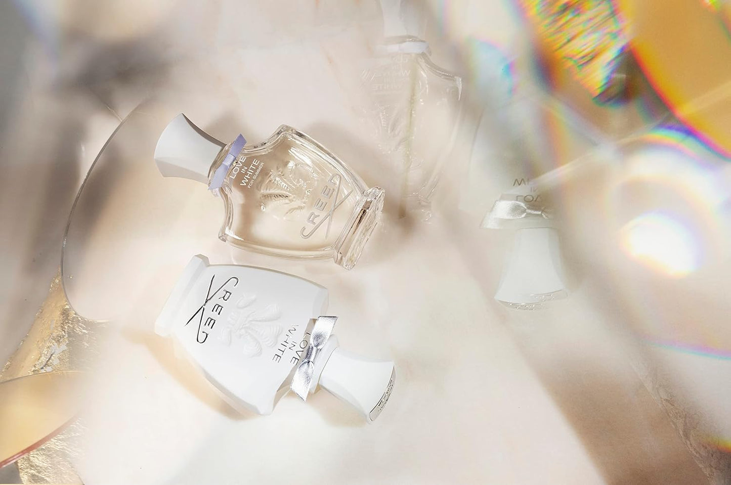 Two perfume bottles with a blurred background