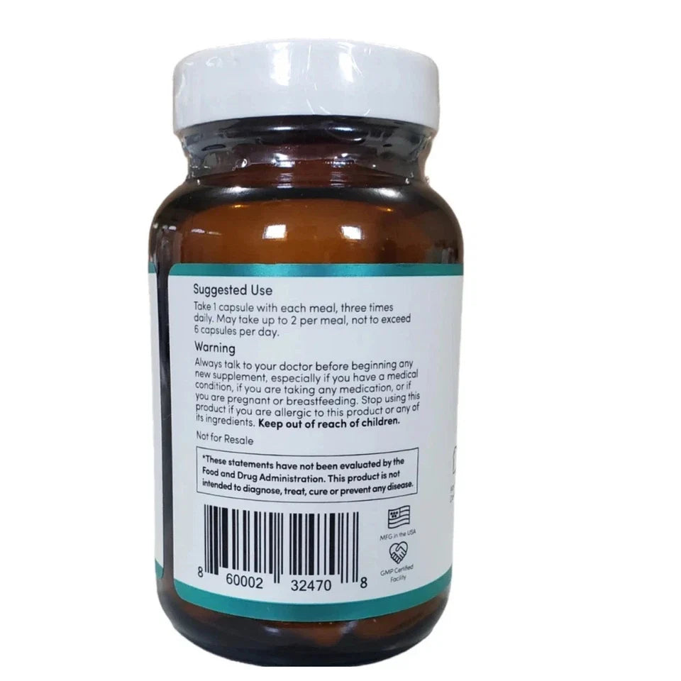 An amber brown supplement bottle with a white cap, showing the back label with usage, warning, and barcode text on a white background.