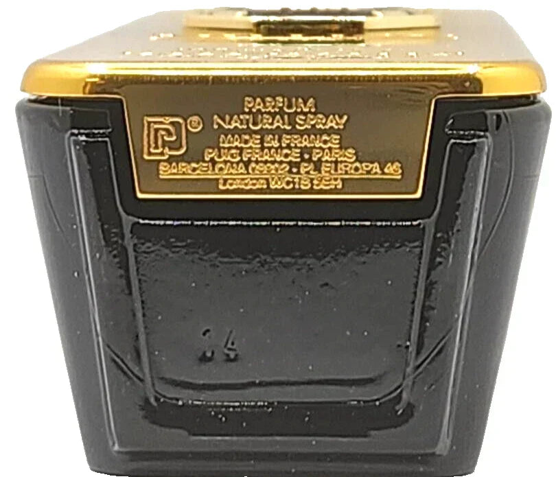 Black and gold perfume bottle with branding on a white background