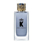 Dolce & Gabbana K perfume bottle with decorative cap on a white background