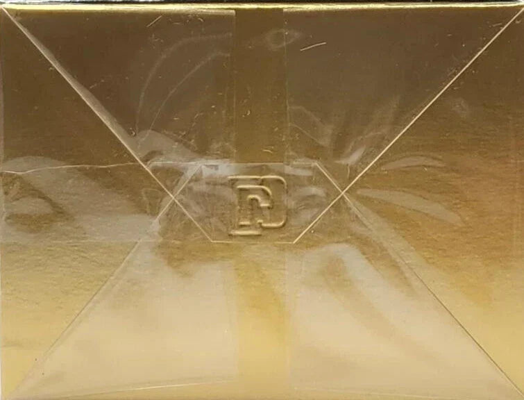Gold rectangular object with a logo on a gold background