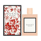 Gucci Bloom perfume bottle and packaging with floral design