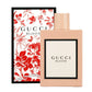 Gucci Bloom perfume bottle and packaging with floral design