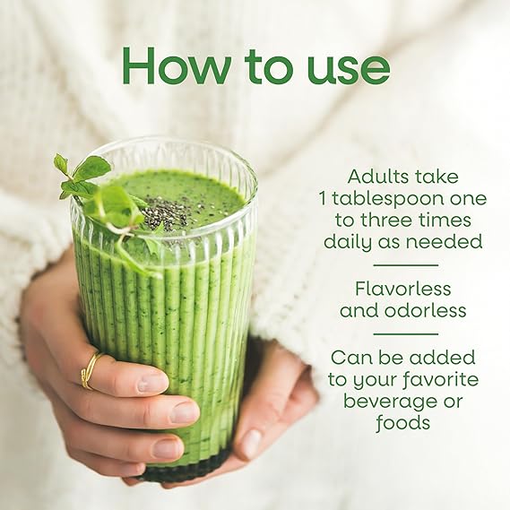 Person holding a glass of green smoothie with text on how to use it.